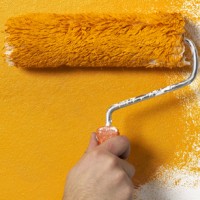 Farbrolle mit oranger Farbe, Bildquelle mearicon - fotolia.de